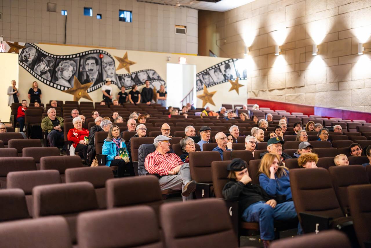 A group of people inside a theatre