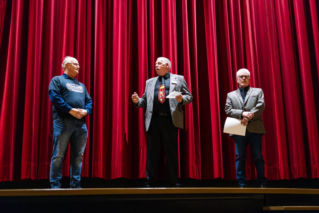 A group of people in front of the stage